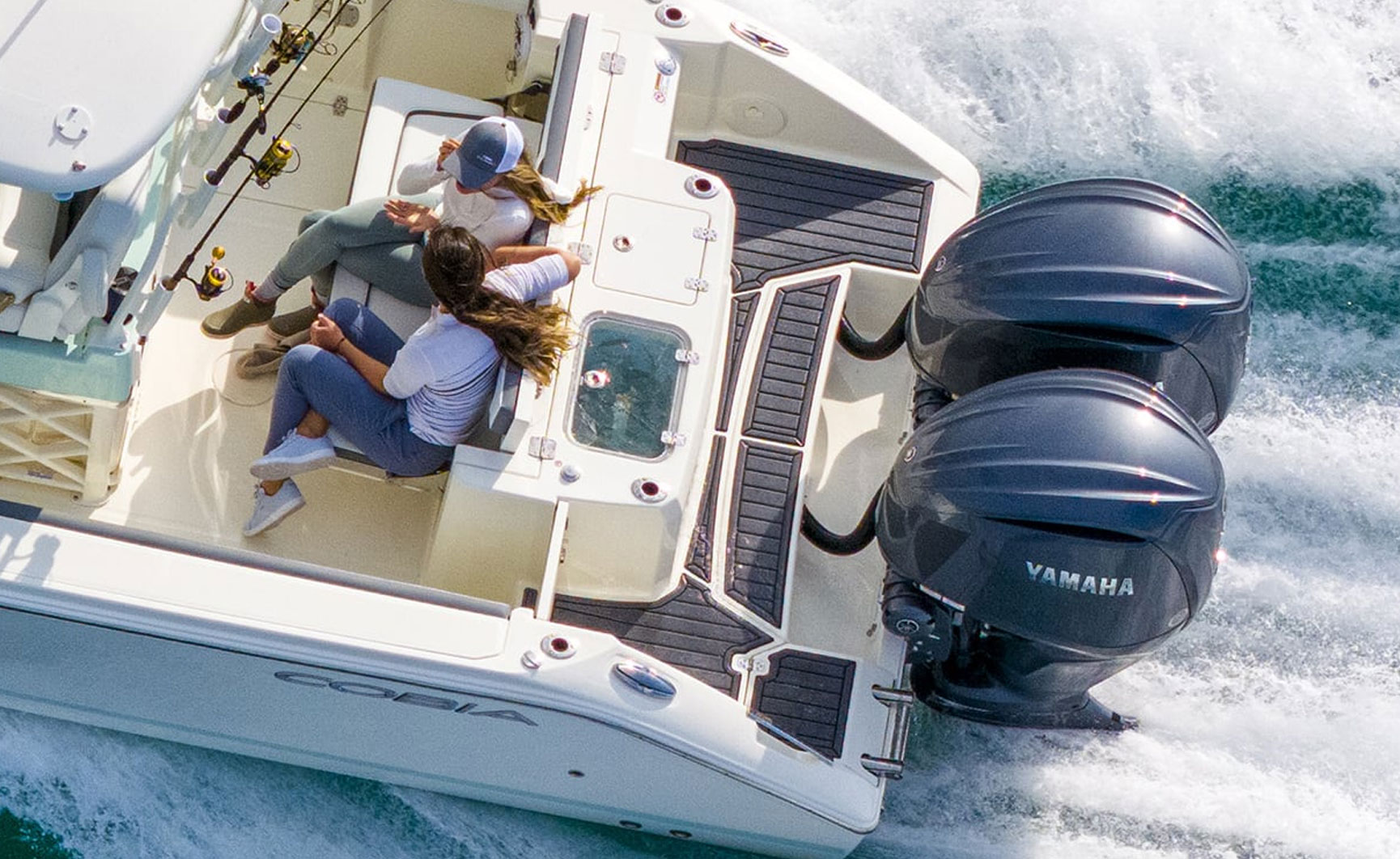 265CC two women at back of boat talking