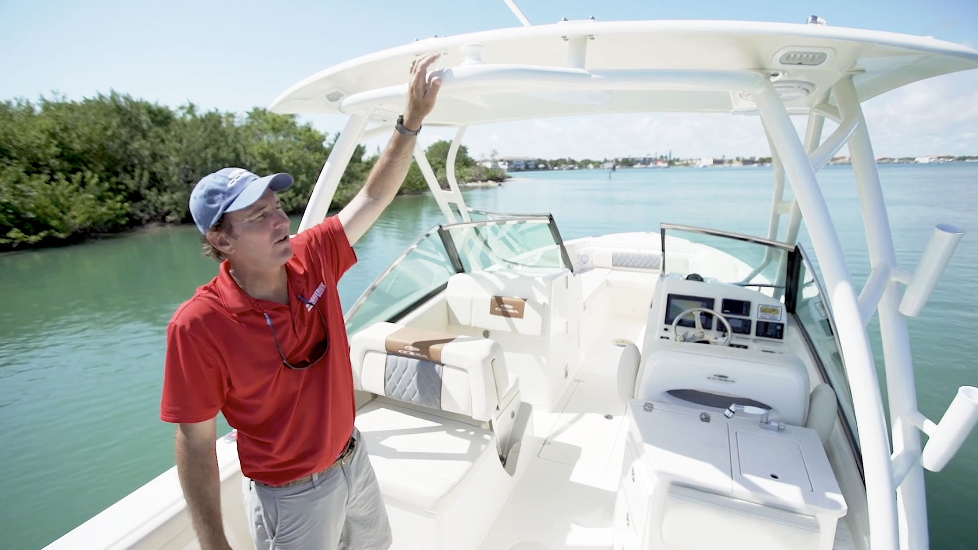 man walking through the 240 dual console boat