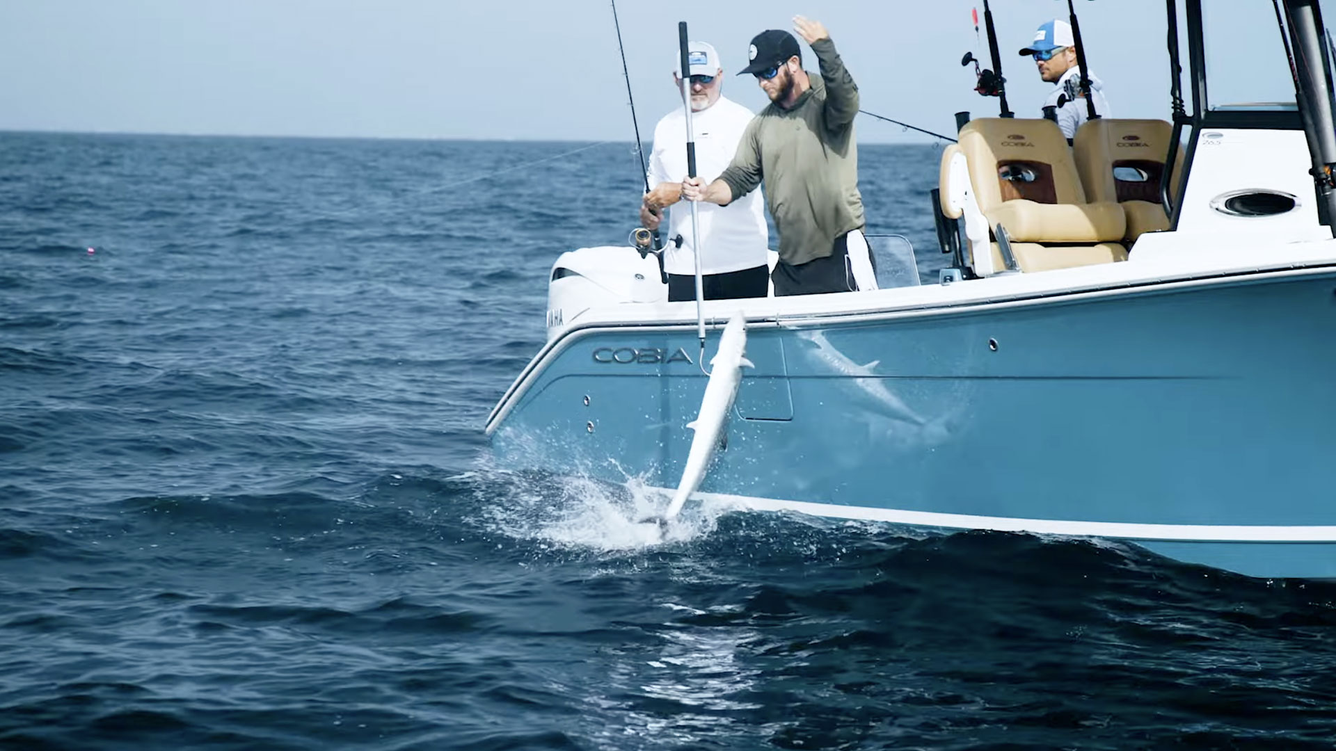 two men fishing on a 265 open