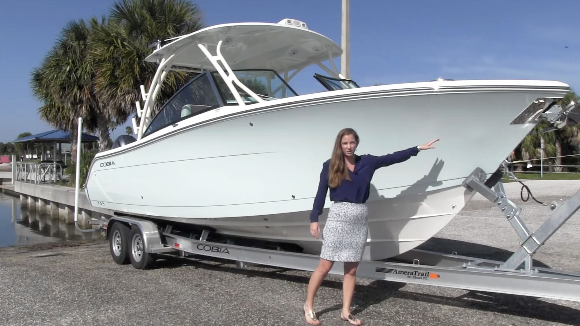 woman giving a walkthrough of the 280cc boat
