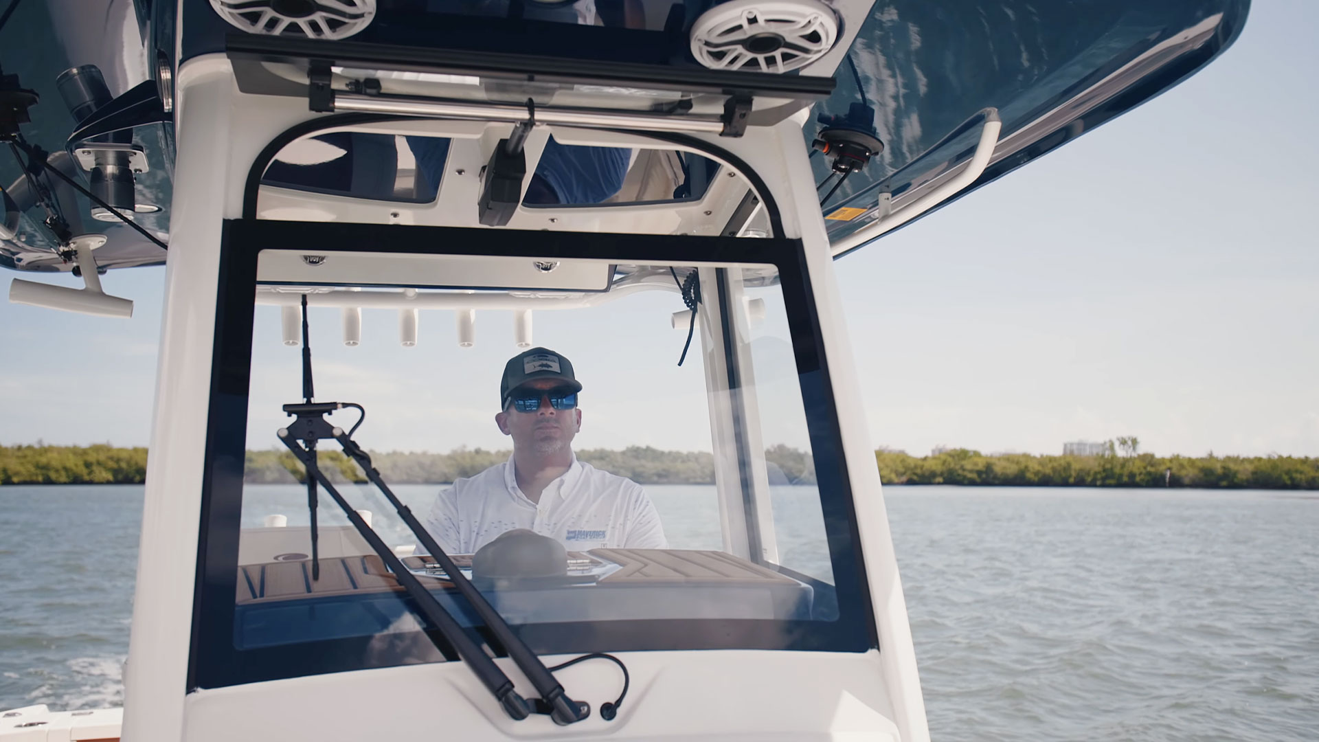 man behind wheel of boat